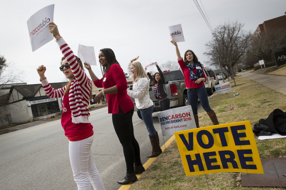 Marco Rubio supporters shout to passing drivers in Columbia, S.C. Polling shows that close to 40 percent of South Carolina voters favor candidates who share their values.