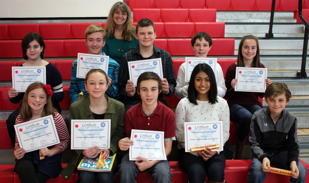 Winners of the recent local level of the National Geographic Society’s 28th National Geography Bee at Wells Junior High School are, second row from left: Natalie Hanagan, Tyler Evans, Ethan Beals, Sam Norbert and Kate Pinette. First row, from left:  Annabelle Breton, Katie Plourde, Griffin Allaire, Jaidyn Patel and Auggie Ciorra. Teacher and moderator Bonnie Dill is in back.
