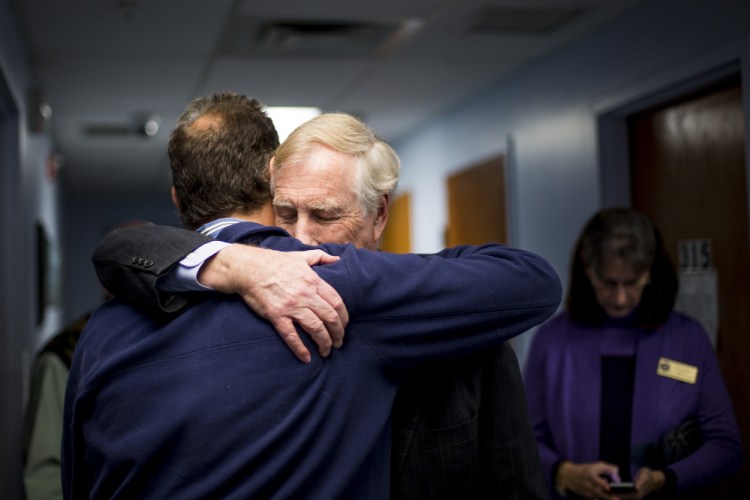 U.S. Sen. Angus King hugs Bob Fowler, executive director of Milestone Foundation Monday after King toured the Foundation’s India Street location and talked about new legislation that would confront the heroin and opioid epidemic facing Maine and much of the nation. Gabe Souza/Staff Photographer