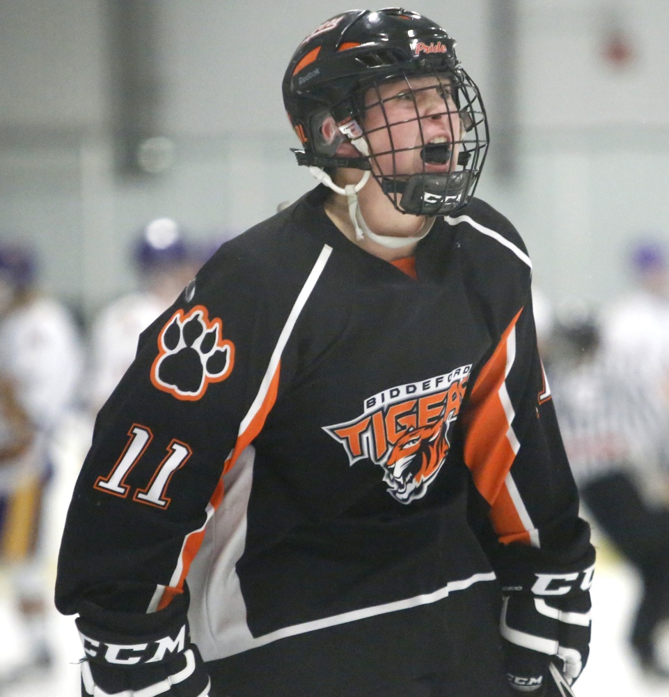 Logan Magnant lets out a roar after Biddeford took the lead in the third period of its Class A South quarterfinal against Cheverus on Monday. The Tigers lost 6-5 in overtime.