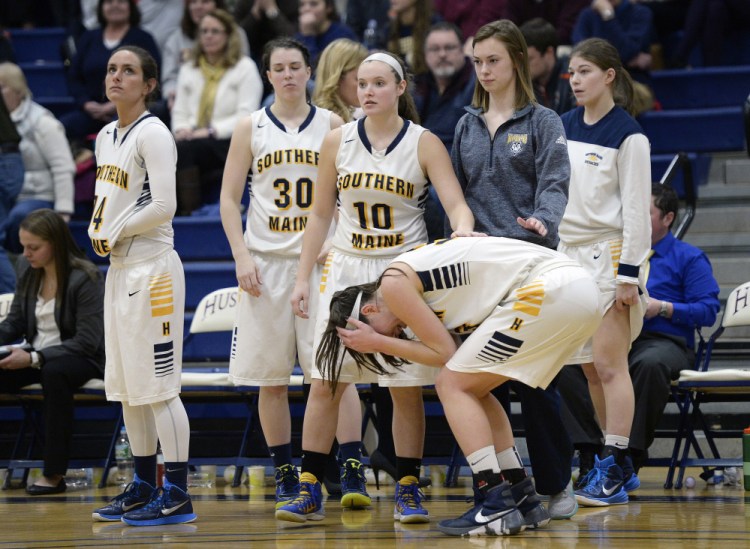 University of Southern Maine’s Megan Pelletier, right, is consoled by teammates as the time expires and USM was defeated by UMass-Dartmouth on Tuesday in Gorham.   Shawn Patrick Ouellette/Staff Photographer