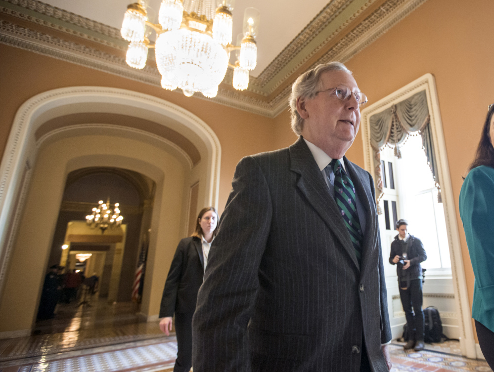 Senate Majority Leader Mitch McConnell walks to the chamber where he offered a tribute to the late Supreme Court Justice Antonin Scalia whose death has triggered an election-year political standoff, on Capitol Hill in Washington, Monday.
