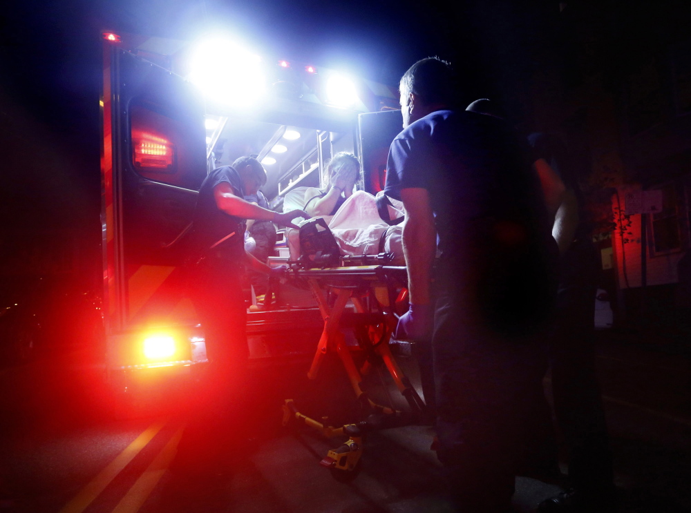 Portland paramedics respond to a report of a heroin overdose last August. State Medicaid cutbacks have made it harder for the growing number of people seeking opiate addiction treatment in Maine to get long-term outpatient services.