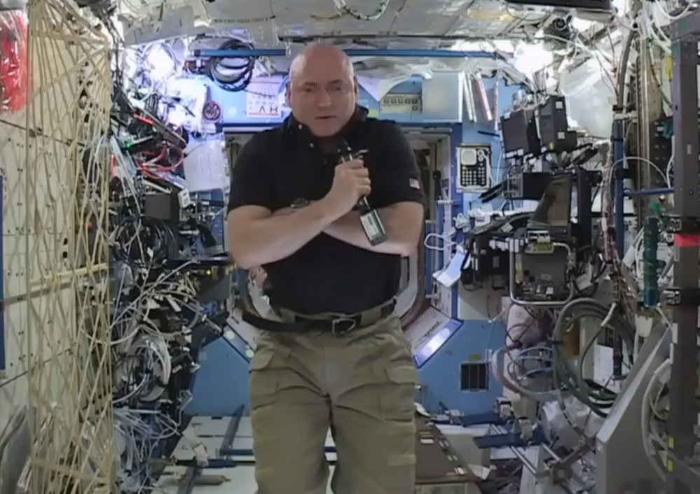 Astronaut Scott Kelly speaks to reporters during a news conference held from the International Space Station on Thursday. After nearly a year in space, Kelly is just a few days away from returning to Earth.
At left, in image from video made available by NASA on Tuesday, Kelly wears a gorilla costume, a gift from his identical twin brother, former astronaut Mark Kelly.