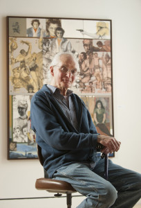 UMaine art instructor Michael Lewis poses for a portrait at Lord Hall Gallery in front of “Painter’s Children,” the earliest of 52 works of art on display from his 50-year career as an art teacher. 