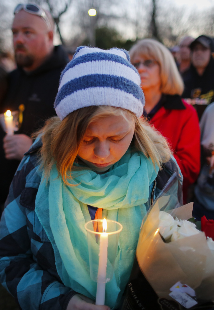 A candlelight vigil at Heritage Park in Hesston, Kan.,  on Friday helps bring a stricken community together after Thursday’s massacre.