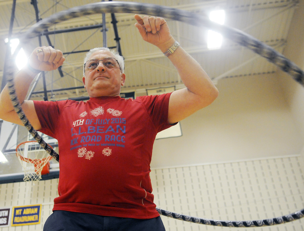 Frank Yocono of Leeds gets a workout Sunday during the “hula hoop jam” at the Winthrop Middle School gym.