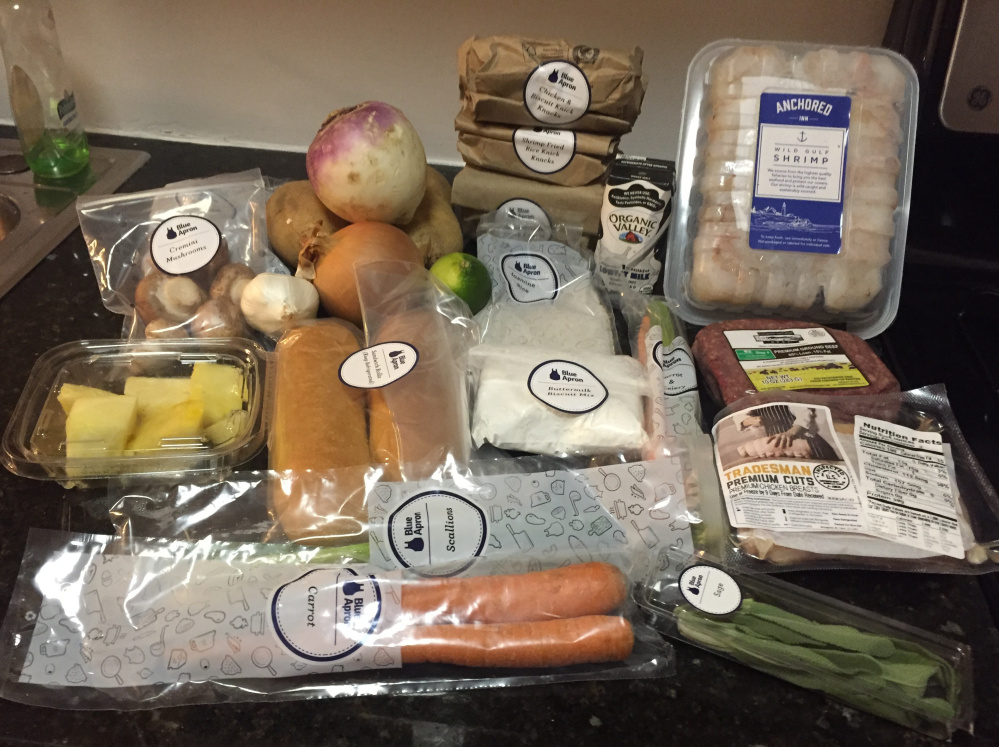 Ingredients from a three-meal Blue Apron box are displayed in New York. Many meal-kit customers live in cities, where it’s easier to get boxes delivered, said Darren Seifer, a food and beverage industry analyst. Expanding into more suburban areas may be tough because homes are more spread apart.