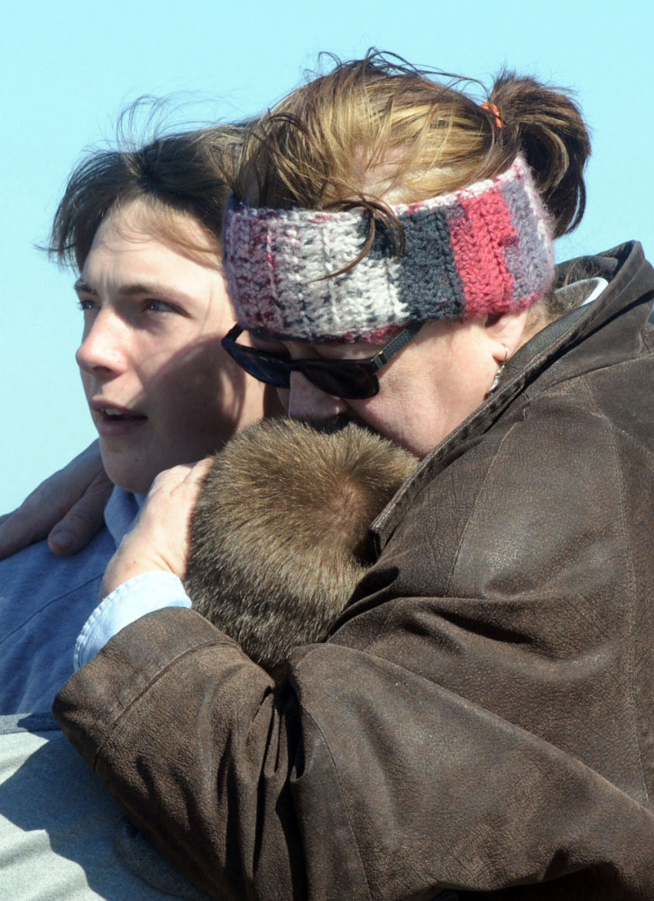 A child is comforted after a school shooting that wounded two students at Madison Local Schools near Middletown, Ohio, Monday.