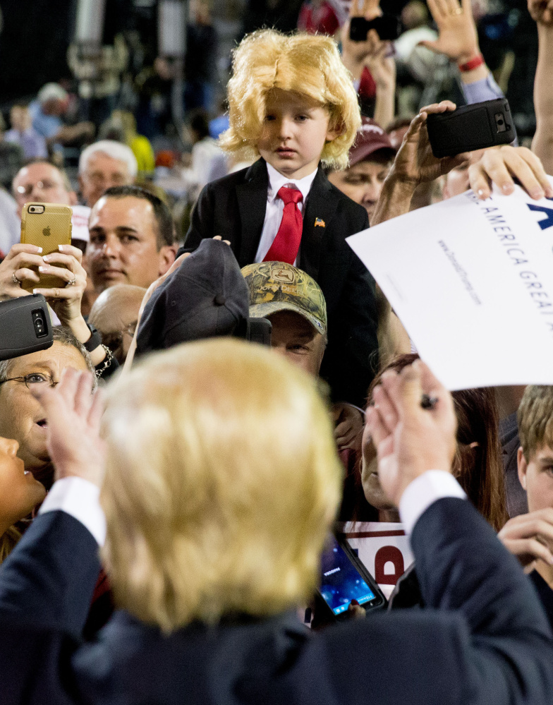 Donald Trump gestures to Colton Jordan, 5, following a rally in Valdosta, Ga., Monday. Trump’s speech was interrupted by Black Lives Matter and immigration protesters.