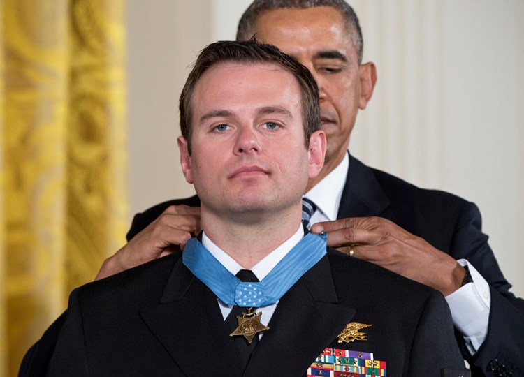 President Barack Obama presents the Medal of Honor to Senior Chief Special Warfare Operator Edward Byers during a ceremony at the White House Monday. The Associated Press