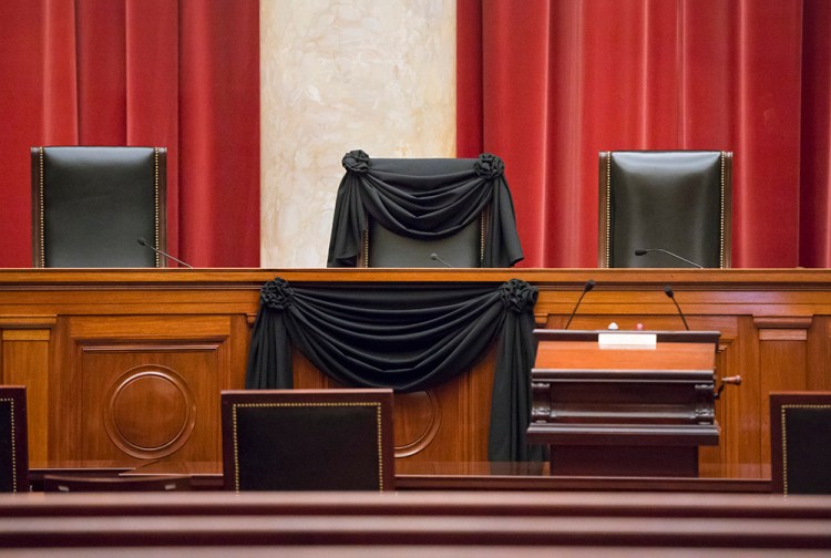 Supreme Court Justice Antonin Scalia’s courtroom chair is draped in black to mark his death – a tradition that dates to the 19th century. The Associated Press