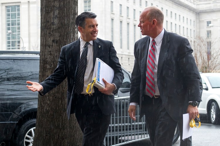 Nevada Gov. Brian Sandoval, left, and Wyoming Gov. Matthew Mead talk as they arrive at the National Governors Association Winter Meeting in Washington on Sunday. The Associated Press