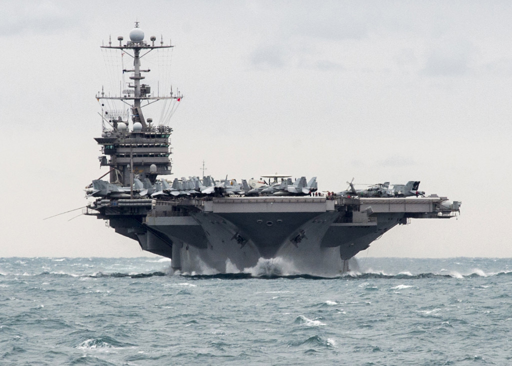 In this Saturday, Dec. 26, 2015 photo released by the U.S. Navy, the aircraft carrier USS Harry S. Truman transits the Strait of Hormuz. The Associated Oress/Mass Communication Specialist 2nd Class M. J. Lieberknecht/U.S. Navy