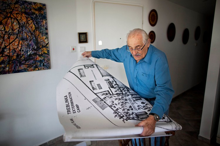 In this 2010 file photo, Holocaust survivor Samuel Willenberg displays a map of Treblinka extermination camp.