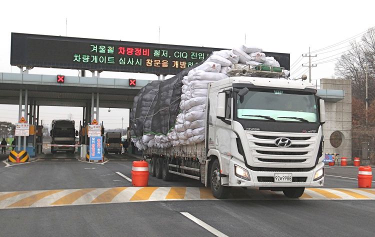 A South Korean cargo truck returning from North Korea's joint Kaesong Industrial Complex passes the customs, immigration and quarantine office near the border village of Panmunjom, in Paju, South Korea, Thursday. The Associated Press
