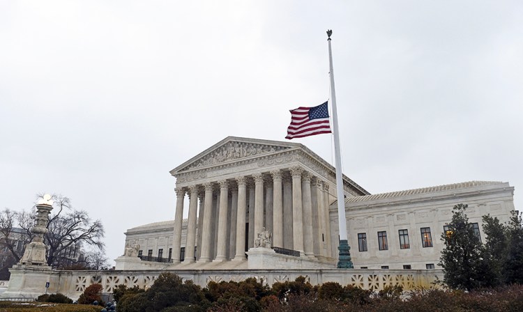 The flag flies at half-staff outside the Supreme Court in Washington following the death of  Justice Antonin Scalia over the weekend. The Associated Press