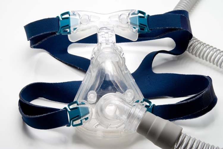 A Continuous Positive Airway Pressure (CPAP) machine consists of a pump that supplies steady air pressure, a hose and either a mask (shown here) or nose piece that regulates breathing. One study suggests that some sleep apnea sufferers can experience serious health effects by not using the machine for one night. Shutterstock image