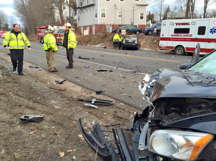 First responders work at the scene of Tuesday morning's collision on Route 236.