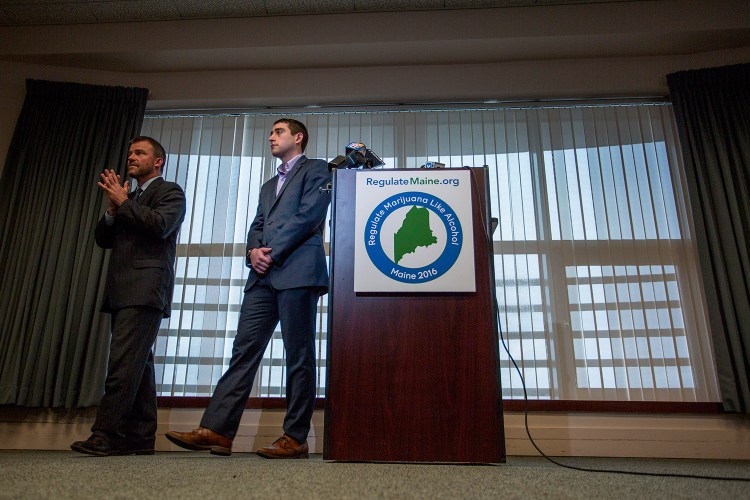 Attorney Scott Anderson, left, and David Boyer, campaign manager for the Campaign to Regulate Marijuana Like Alcohol, step away from a podium Thursday at Verrill Dana in Portland after announcing their lawsuit to appeal the Maine secretary of state's decision to disqualify the question of  legalizing marijuana from the November ballot.