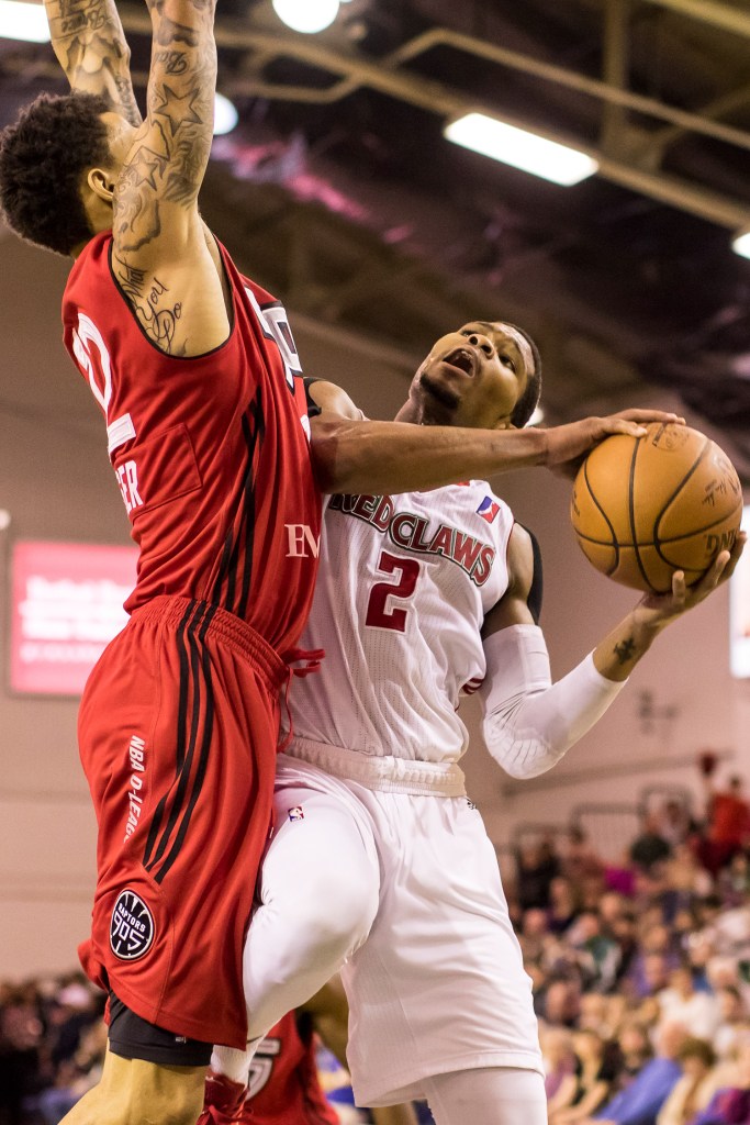 Maine Red Claws' guard Corey Walden drives against Raptors 905 forward Michale Kyser during Sunday's action.