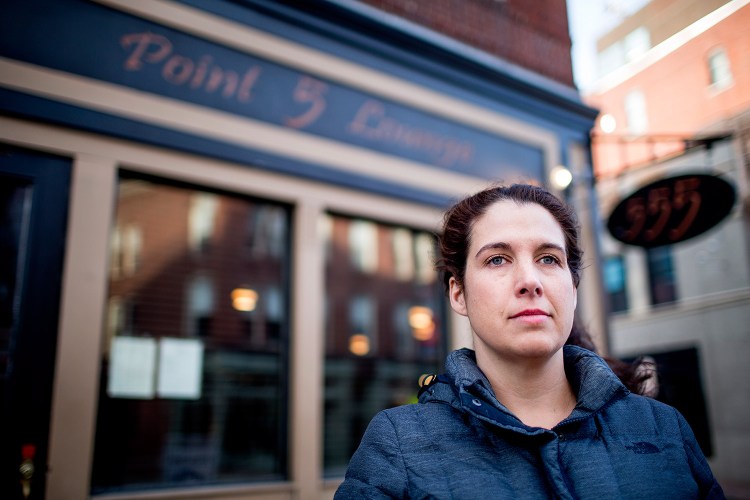 Heather McIntosh of Portland, in front of her former employer, Five Fifty-Five on Congress Street, said in a letter to the editor that she and her co-workers disagree with the restaurant's owners and favor an increase in the minimum wage, including for servers. 
Gabe Souza/Staff Photographer