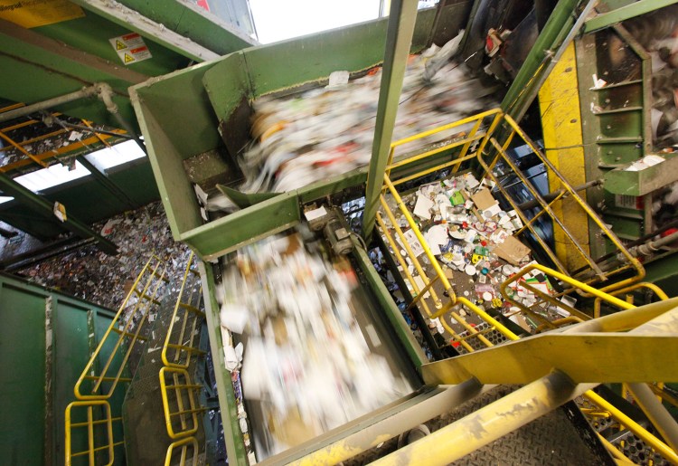 A conveyor belt carries recyclable materials to be sorted at ecomaine. 