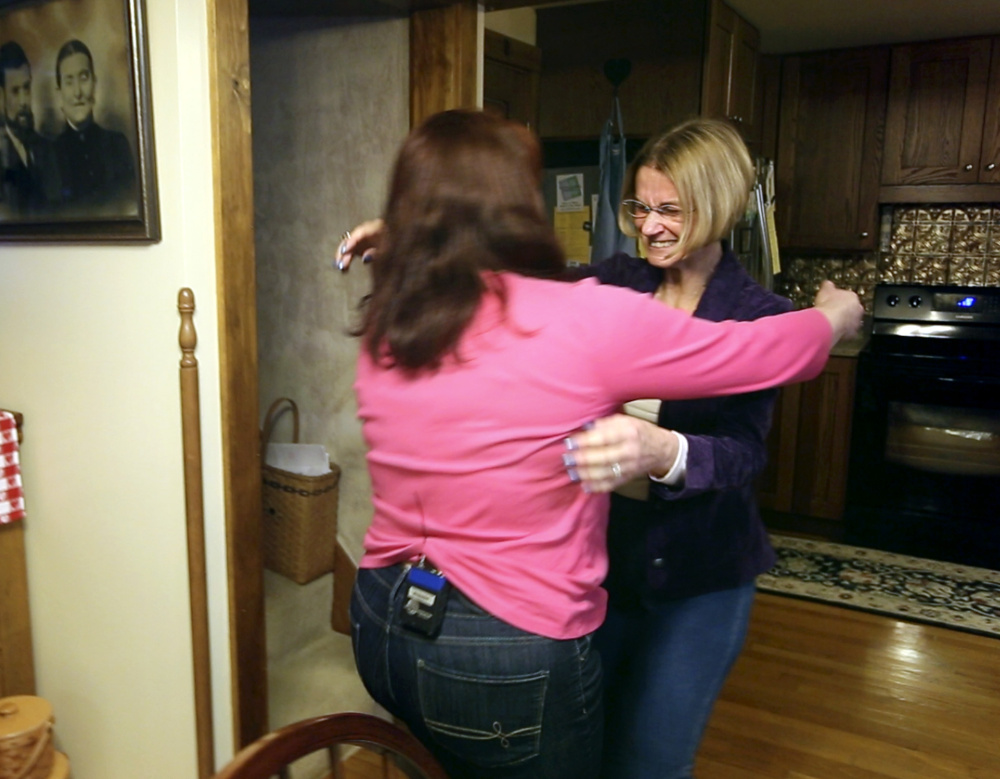 Linda Deming, right, and Amber McIntyre meet for the first time at Deming’s home in Pownal on Monday night. A transplant scheduled for Tuesday will culminate Deming’s search for a kidney donor.