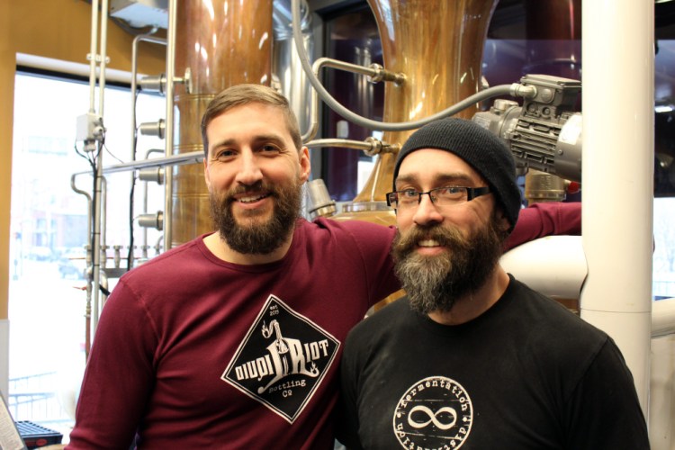 Eric Michaud, left, and brother Ian Michaud operate Liquid Riot Bottling Company in Portland.
