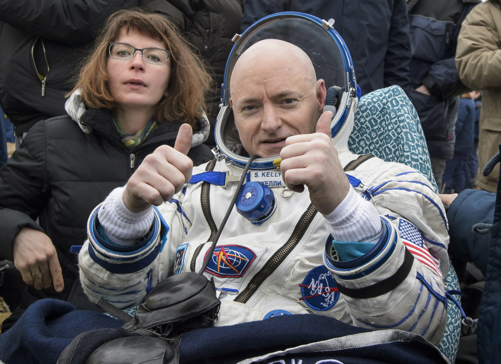 International Space Station crew member Scott Kelly gives the two-thumbs-up sign after landing in Kazakhstan Wednesday.  His 340-day mission was the longest time spent in space by an American.