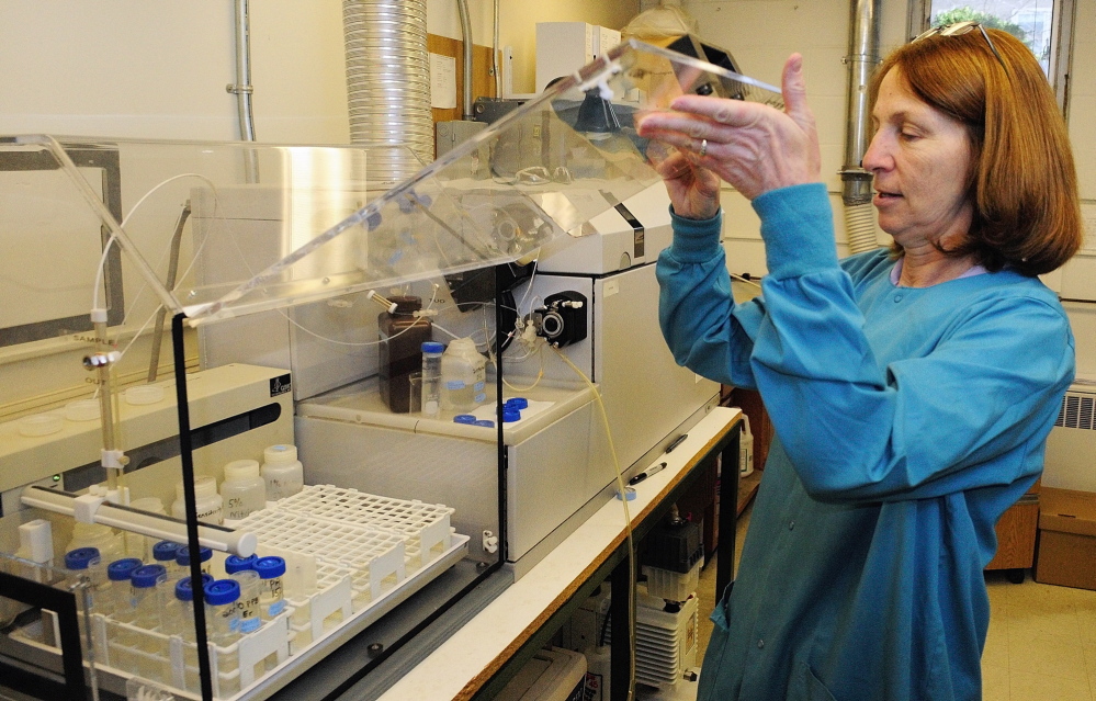Chemist Cheryl Soucy runs water tests in April 2014 at the Maine Center for Disease Control and Prevention. Soucy uses the inductively coupled plasma mass spectrometer to test water for arsenic and other contaminants.