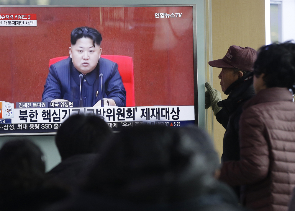 South Koreans watch North Korean leader Kim Jong-un appear on TV in Seoul on Thursday, after the North fired six short-range projectiles into the sea off its east coast.