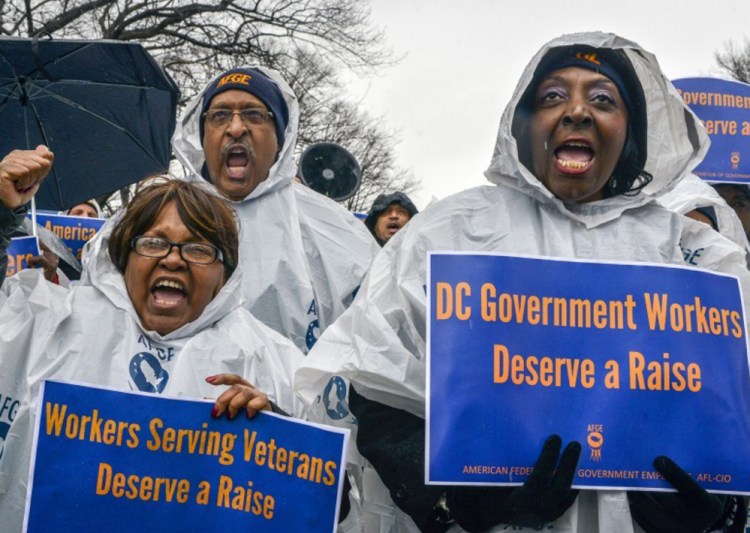 Members of the American Federation of Government Employees, representing more than 600,000 workers, rally for a pay raise Feb. 9 in Washington.
