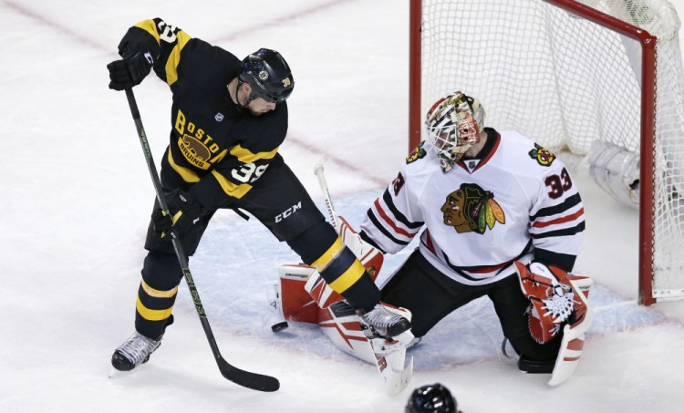 Chicago goalie Scott Darling makes a save as Bruins left wing Matt Beleskey tries to backhand the rebound in the third period.