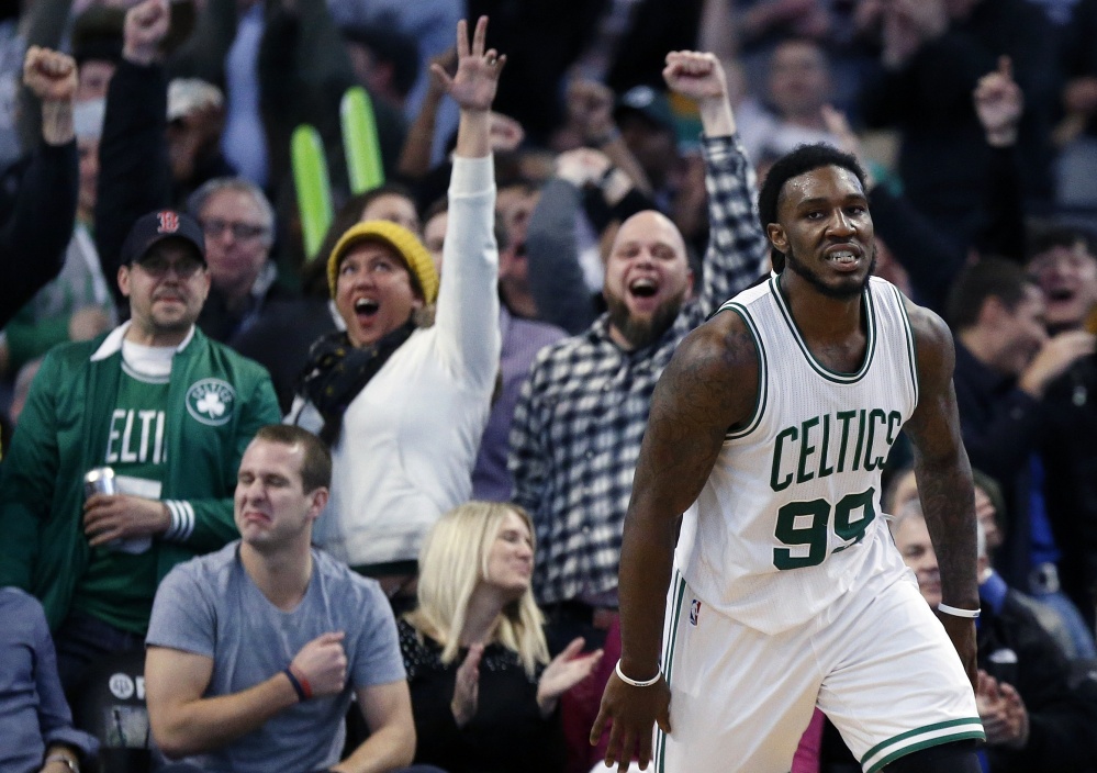 Boston fans erupt after the Celtics’ Jae Crowder scores on a dunk in the fourth quarter of Friday night’s game against the New York Knicks. The Celtics won in the final seconds, 105-104.