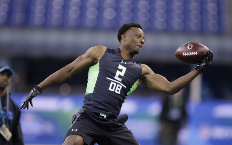 In this Feb. 29, 2016, file photo, Ohio State defensive back Eli Apple runs a drill at the NFL football scouting combine in Indianapolis.  The Associated Press