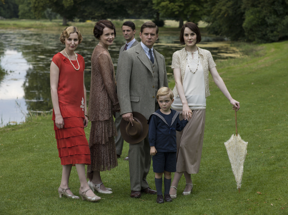 Laura Carmichael as Lady Edith, left, Elizabeth McGovern as Cora, Countess of Grantham, Matthew Goode as Henry Talbot, Allen Leech as Tom Branson, Zac Barker as Master George and Michelle Dockery as Lady Mary.
