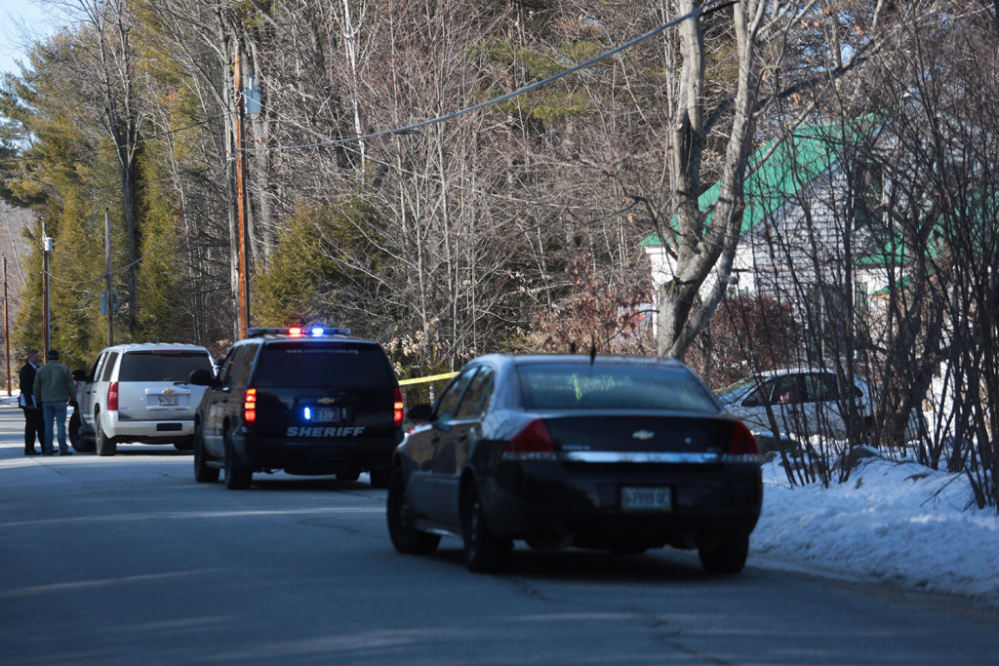 Police vehicles converge at the scene of a fatal shooting at 331 Hancock Pond Road in Sebago on Saturday.