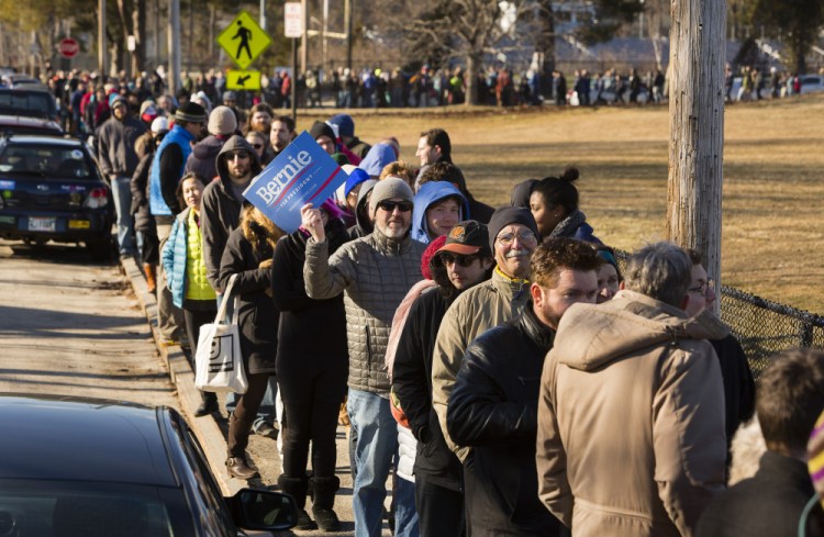Voters wait in line to take part in the Democratic caucus at Deering High School in Portland on March 6.  
Carl D. Walsh/Staff Photographer