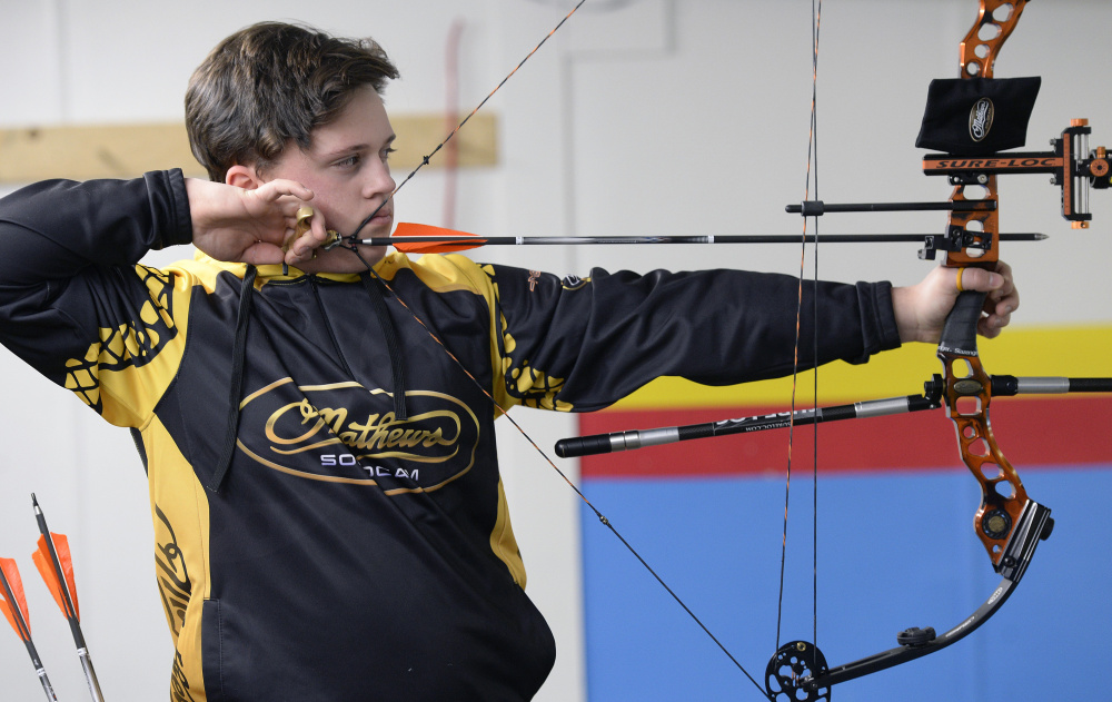 Malcolm Bourgeois, 13, of North Yarmouth takes aim at his target while practicing at Howell’s Gun & Archery Center in Gray  on Wednesday.