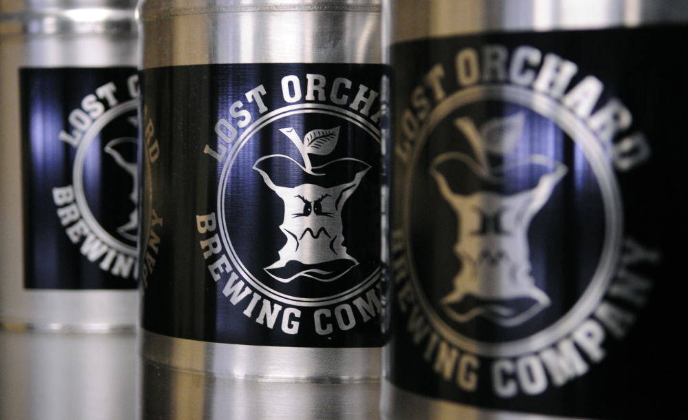 Logos go on kegs at Lost Orchard Brewing Co. in South Gardiner. Joe Phelan/Kennebec Journal