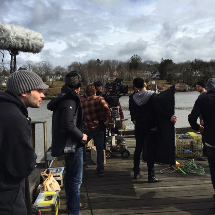 Crew members prepare for filming on the independent horror movie “Island Zero” on the pier in Rockport last week. The screenplay was written by best-selling Camden author Tess Gerritsen and is directed by her son, Josh Gerritsen.