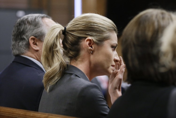 Erin Andrews wipes tears as the verdict is read Monday in Nashville, Tenn. A jury awarded Andrews $55 million in her lawsuit against a stalker who bought a hotel room next to her and secretly recorded a nude video, finding that the hotel companies and the stalker shared in the blame.