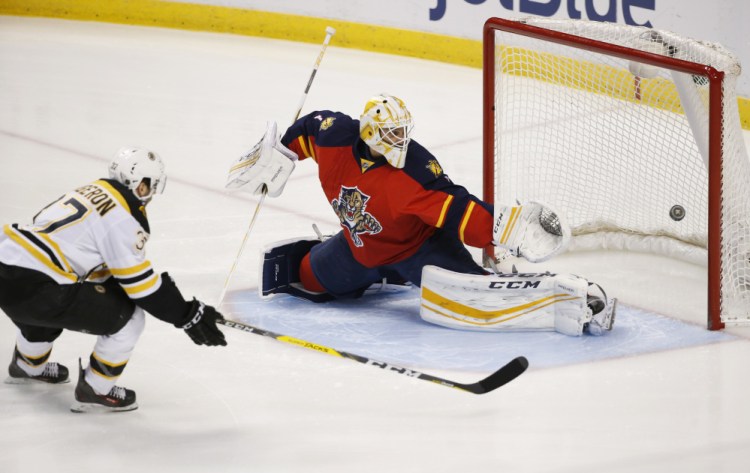 Bruins center Patrice Bergeron gets the Bruins out to a 1-0 lead with a goal against Panthers goalie Roberto Luongo in the first period of Monday night’s game Sunrise, Fla.