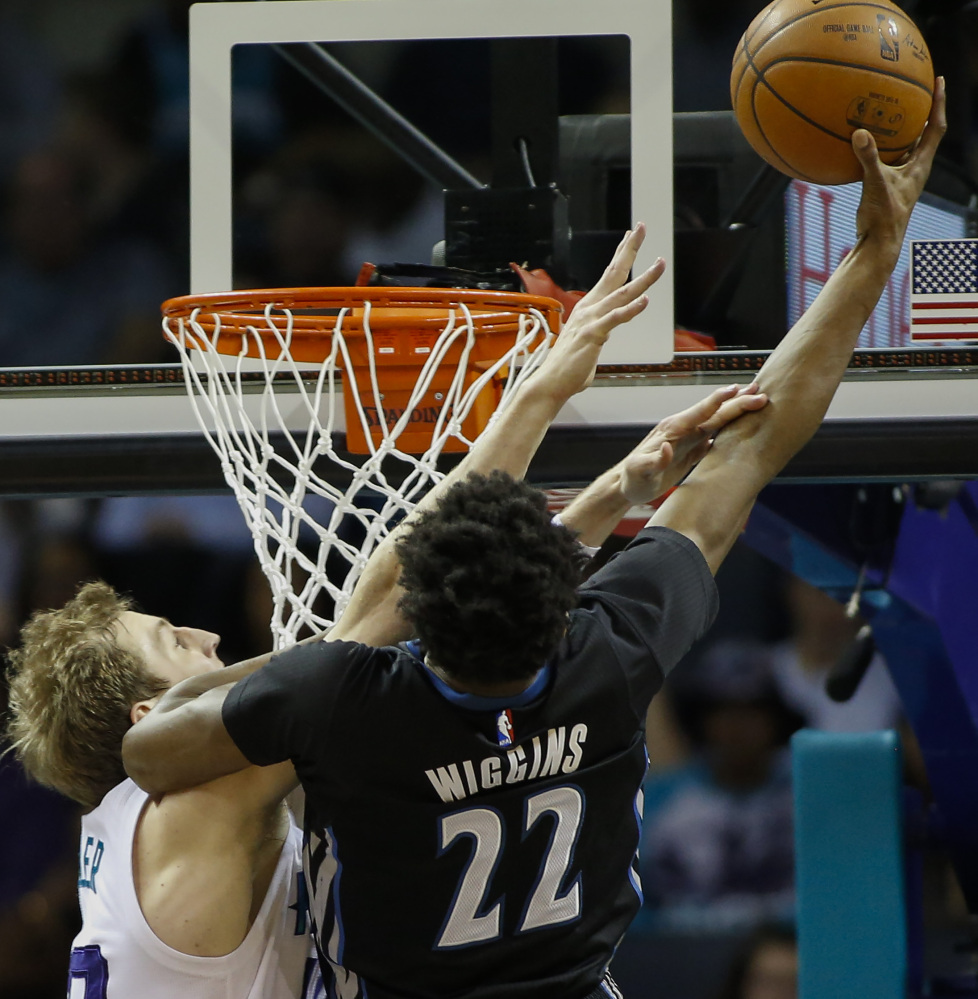 Andrew Wiggins of the Minnesota Timberwolves shoots over Cody Zeller of the Charlotte Hornets in the first half of Charlotte’s 108-103 victory Monday night.