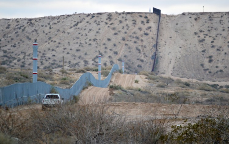 A U.S. Border Patrol agent drives near the U.S.-Mexico border fence in Sunland Park, N.M., in January 2016.