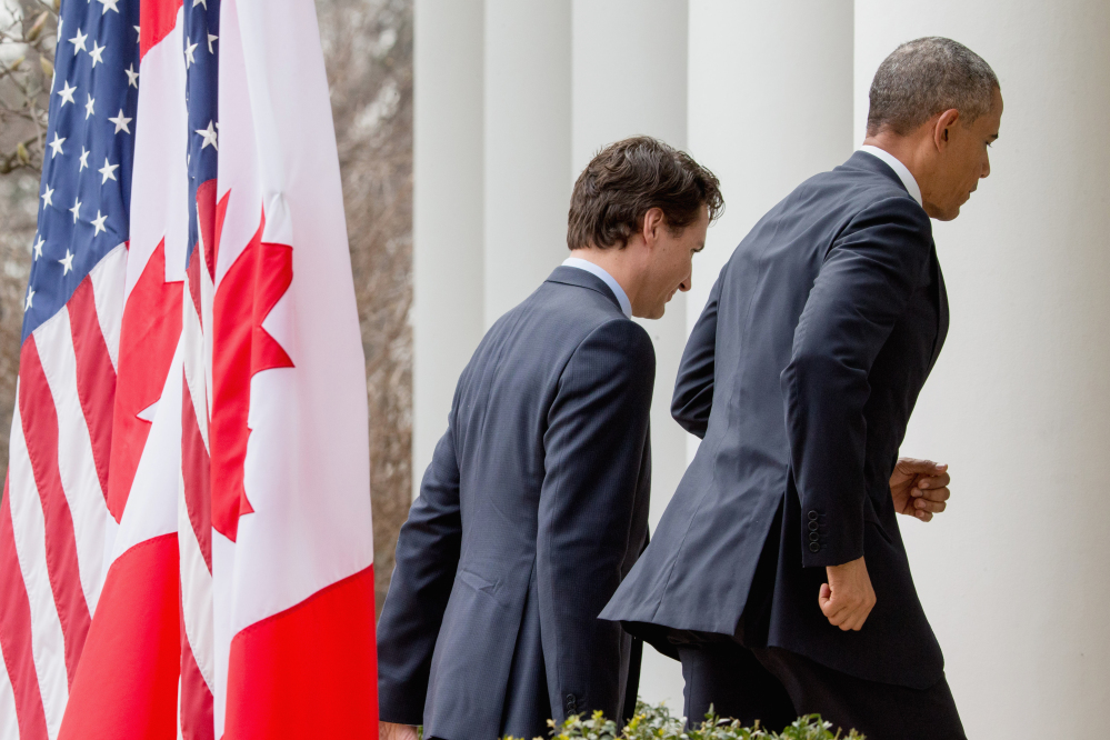 President Barack Obama and Canadian Prime Minister Justin Trudeau depart from a bilateral news conference in the Rose Garden of the White House in Washington on Thursday.