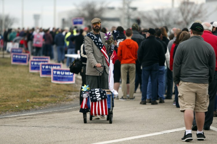 Supporters line up outside the Wright Brothers Aero Hangar for a rally by Republican presidential candidate Donald Trump on Saturday in Vandalia, Ohio.