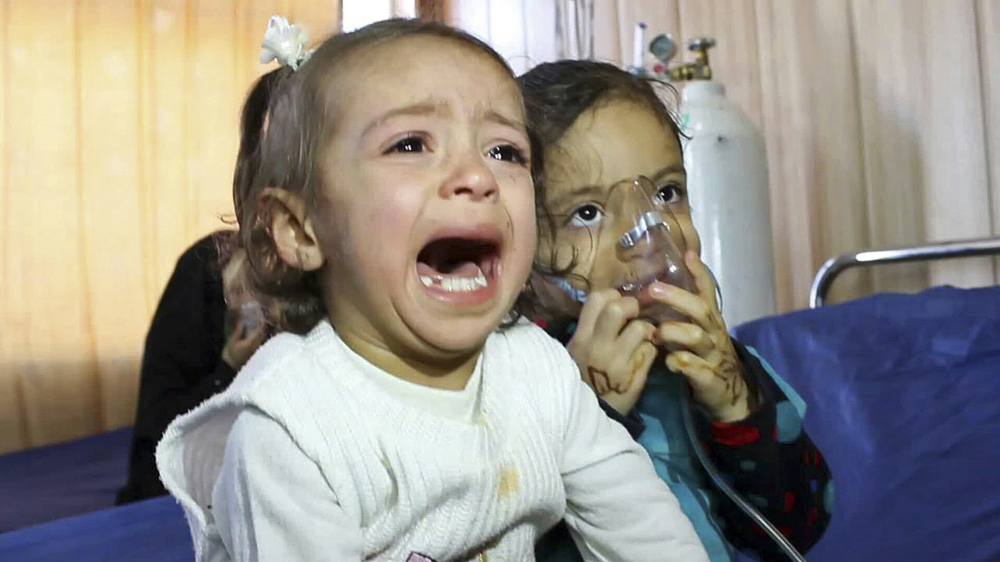 Young victims exposed to a chemical attack wait for treatment at a hospital in Taza, 10 miles south of Kirkuk in northern Iraq. At right, family picture shows Fatima Samir, 3, who died after the chemical attack in Taza.