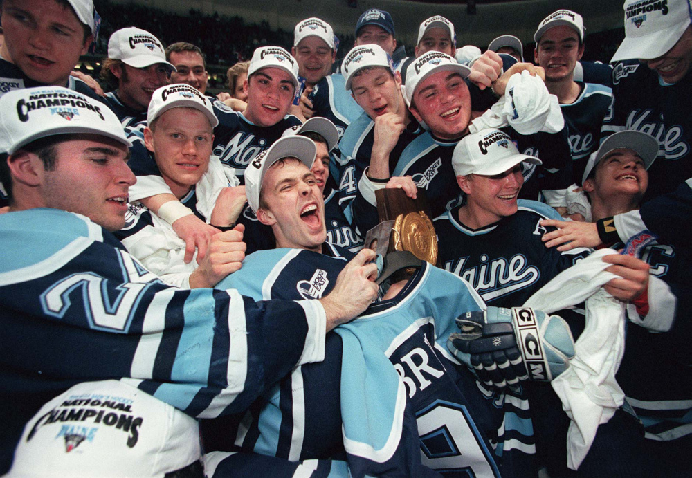 Maine players celebrate their NCAA Division I Hockey Championship win in Anaheim, Calif., in April 1999. The late coach, Shawn Walsh, “got the ball rolling and the ball rolled for a long time,” said Dave Hendrickson, a Maine native and writer for U.S. College Hockey Online. “But once you’ve lost that allure as one of the top three or four teams in Hockey East, than can change fast.”
